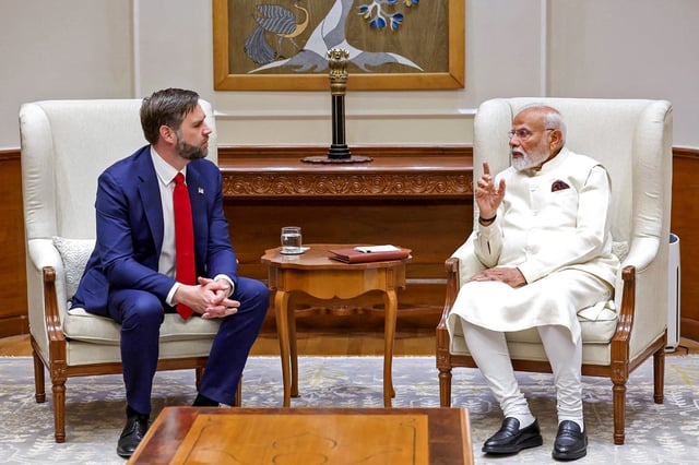 India's Prime Minister Narendra Modi speakS to U.S. Vice President JD Vance in New Delhi on April 21, 2025.