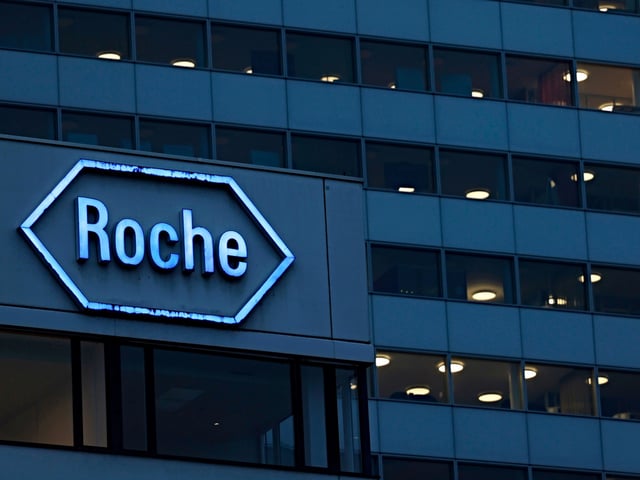 Signage for Roche Holding AG on a building in the company's headquarters campus in Basel, Switzerland, on Monday, Jan. 8, 2023. Swiss pharma giants Roche and Novartis AG embody opposing approaches to solving a fundamental puzzle: how to placate shareholders and keep growing in an industry where the hunt for the next blockbuster drug is paramount. Photographer: Stefan Wermuth/Bloomberg