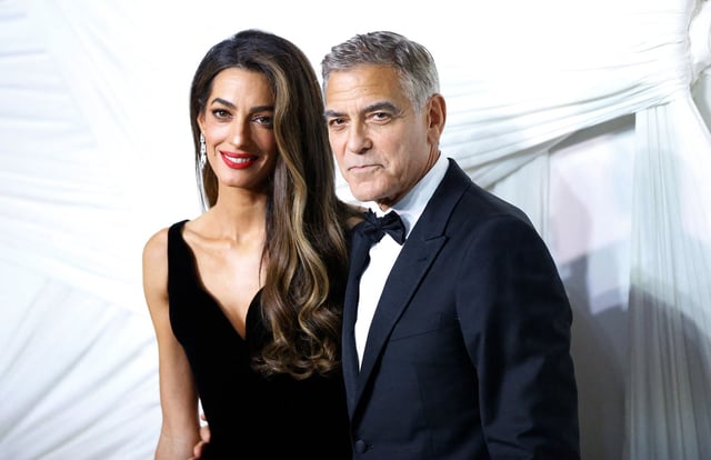 George Clooney (R) and his wife Lebanese-British barrister Amal Clooney arrive for "The Albies" hosted by the Clooney Foundation for Justice at the New York Public Library in New York, September 26, 2024.
