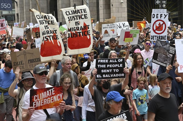 Protesters in Manhattan marching against Trump administration&#39;s attacks on the government, climate, tariffs, immigration and education among many other issues, April 19 2025.