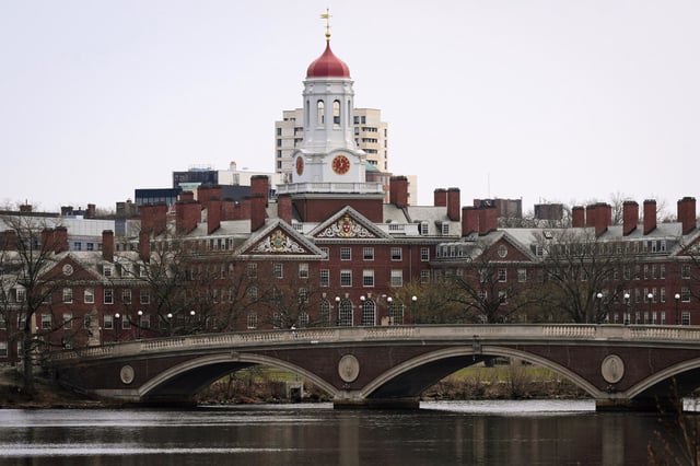 Water flows down the Charles River in front of Harvard University on Tuesday, April 15, 2025, in Cambridge, Mass.
