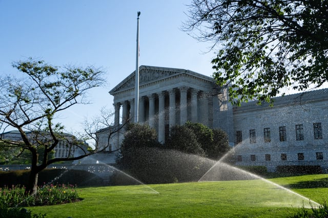 Sprinklers water the lawn in front of the Supreme Court on April 29, 2024.