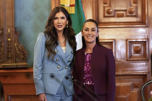 US Homeland Security Secretary Kristi Noem (L), and Mexican President Claudia Sheinbaum pose for photos at the National Palace in Mexico City, on March 28, 2025.