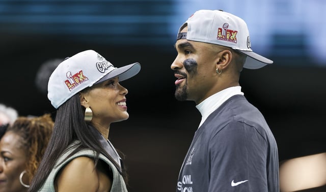 Jalen Hurts #1 of the Philadelphia Eagles stands with fiancée Bry Burrows on Feb. 09, 2025, in New Orleans, LA.
