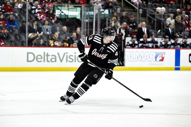 Apr 11, 2025; Newark, New Jersey, USA; New Jersey Devils defenseman Luke Hughes (43) skates with the puck during the third period against the Pittsburgh Penguins at Prudential Center. Mandatory Credit: John Jones-Imagn Images/File Photo