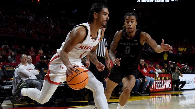 Terp Rodney Rice is guarded by UMES’ KC Shaw in first half action.  University of Maryland vs University of Maryland Eastern Shore men’s basketball.   (Barbara Haddock Taylor/Staff)