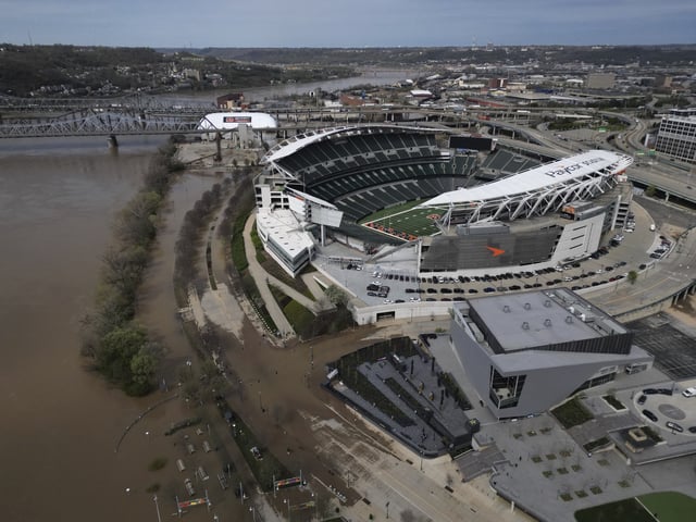 The Ohio River floods the riverfront area of Paycor Stadium, home of the Cincinnati Bengals NFL football team, Wednesday, April 9, 2025, in Cincinnati. (AP Photo/Carolyn Kaster)