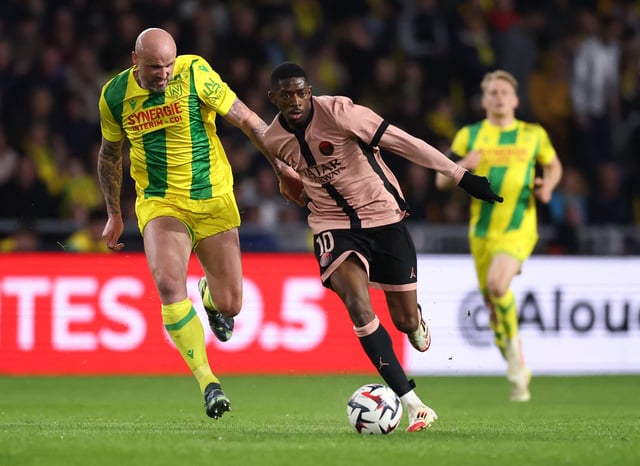 Soccer Football - Ligue 1 - Nantes v Paris St Germain - The Stade de la Beaujoire - Louis Fonteneau, Nantes, France - April 22, 2025 Paris St Germain's Ousmane Dembele in action with Nantes' Nicolas Pallois REUTERS/Stephane Mahe