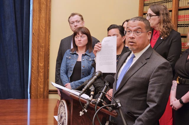 Democratic Minnesota Attorney General Keith Ellison holds up a letter from U.S. Attorney General Pam Bondi at a news conference at the State Capitol in St. Paul, Minn., on Tuesday, April 22, 2025, as he held a news conference to announce a preemptive lawsuit againstRepublican President Donald Trump seeking to block his administration from acting against Minnesota in the way it's taking on Maine under a federal push to ban transgender athletes from girls and women's sports. (AP Photo/Steve Karnowski)