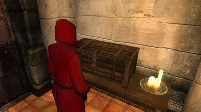 Oblivion - A player in a red robe looks at a locked wooden chest