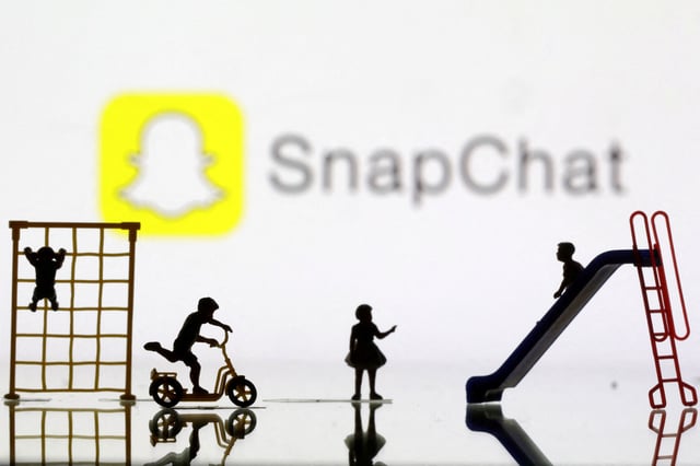 Children playground miniatures are seen in front of displayed Snapchat logo in this illustration taken April 4, 2023. REUTERS/Dado Ruvic/Illustration/File Photo