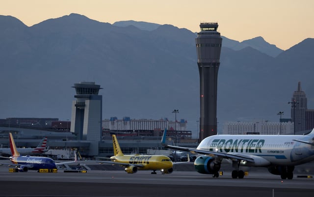 LAS VEGAS, NEVADA - OCTOBER 14: A Frontier Airlines plane prepare to take off from Harry Reid International Airport as  Southwest Airlines and Spirit Airlines planes taxi on October 14, 2022 in Las Vegas, Nevada. Holiday airfare prices are expected to be the most expensive in the last 5 years with Thanksgiving ticket prices up 25 percent from last year with the average round trip ticket price of $281. Christmas travel costs are up 55 percent from last year with round trip ticket prices averaging $435. (Photo by Justin Sullivan/Getty Images)