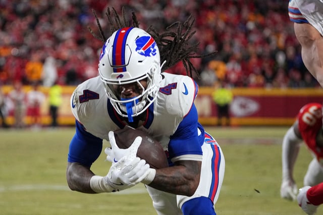 Jan 26, 2025; Kansas City, MO, USA; Buffalo Bills running back James Cook (4) dives for a touchdown against the Kansas City Chiefs in the AFC Championship game at GEHA Field at Arrowhead Stadium. Mandatory Credit: Denny Medley-Imagn Images/File Photo
