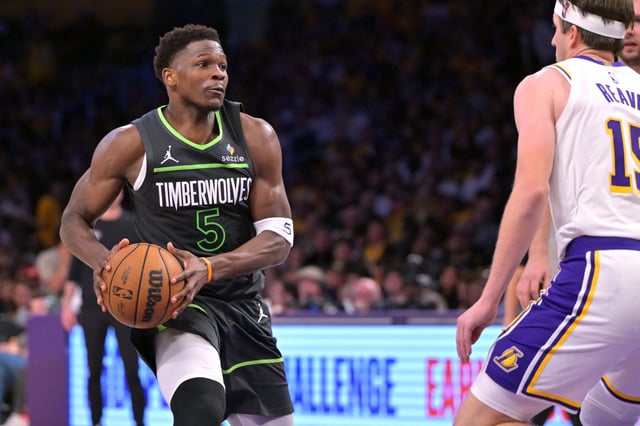 Apr 19, 2025; Los Angeles, California, USA; Minnesota Timberwolves guard Anthony Edwards (5) drives past Los Angeles Lakers guard Austin Reaves (15) in the second half at Crypto.com Arena. Mandatory Credit: Jayne Kamin-Oncea-Imagn Images/File photo