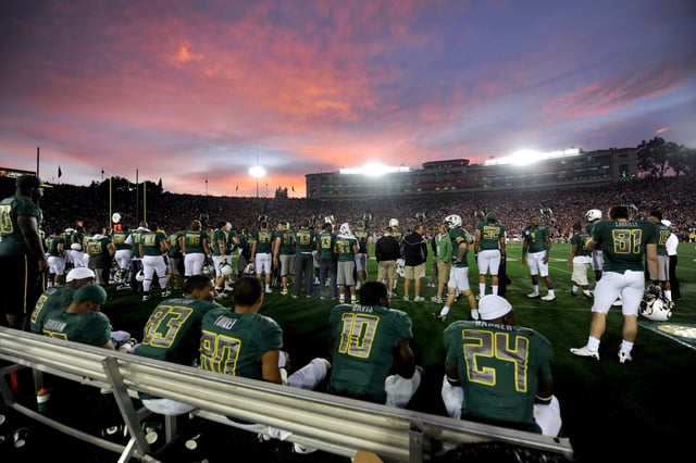 FILE: Members of the Oregon Ducks look on from the bench at dusk in the fourth quarter against the Ohio State Buckeyes in the 96th Rose Bowl played on Jan. 1, 2010, in Pasadena, Calif.
