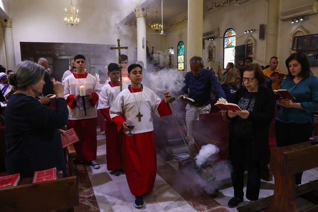 Palestinian Christians in Gaza mourn the death of Pope Francis, who had maintained close contact with the besieged territory's small Christian community since the start of the war, on Monday, April 21, 2025. (Photo by Omar AL-QATTAA / AFP) (Photo by OMAR AL-QATTAA/AFP via Getty Images)