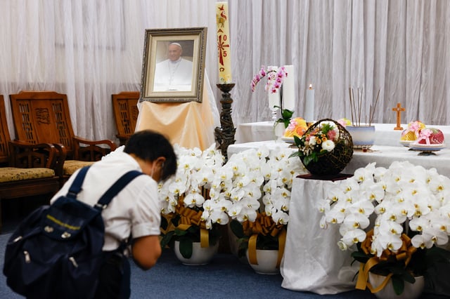 A person pays respects to late Pope Francis at a church of the Catholic Archdiocese of Taipei, Taiwan April 22, 2025. REUTERS/Ann Wang