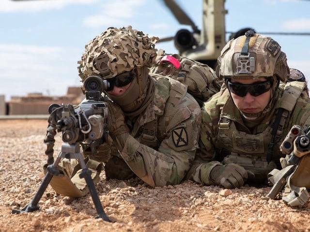Soldiers with the 10th Mountain Division provide security after departing a CH-47 Chinook during air assault training with Syrian partners at Al-Tanf Garrison, Syria, in February.