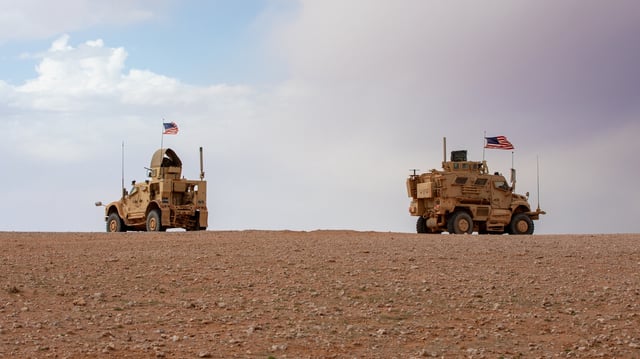 U.S. Army Oshkosh M-ATV and International M1224 MaxxPro mine-resistance ambush protected vehicles and their crews assigned to the 10th Mountain Division, Task Force Armadillo, patrol in the Deconfliction Zone, Syria, March 18.