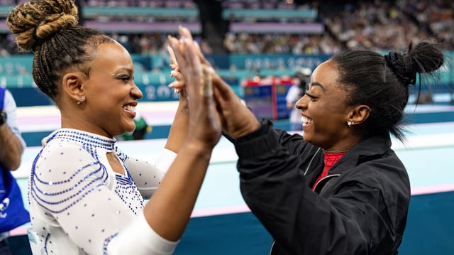 Andrade and Biles high-five after the women's artistic gymnastics vault final at the Paris 2024 Olympics in August.