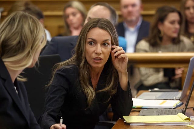 Karen Read chats with her defense team at Karen Read’s second murder trial on April 22. (Staff Photo By Stuart Cahill/Boston Herald)