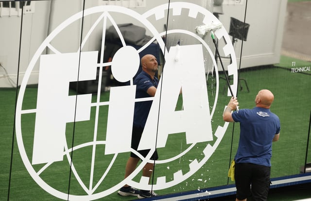 Formula One F1 - Spanish Grand Prix - Circuit de Barcelona-Catalunya, Barcelona, Spain - June 20, 2024 General view as a worker cleans the FiA logo ahead of the Spanish Grand Prix REUTERS/Albert Gea/ File Photo
