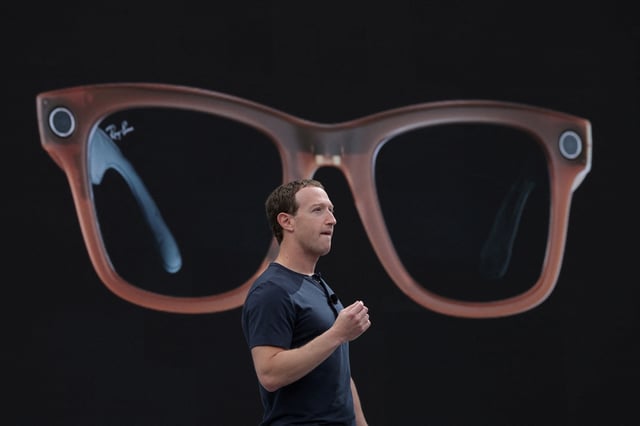 Meta CEO Mark Zuckerberg delivers a speech, as a pair of Ray-Ban smart glasses appear on screen, during the Meta Connect event at the company's headquarters in Menlo Park, California, U.S., September 27, 2023. REUTERS/Carlos Barria     TPX IMAGES OF THE DAY