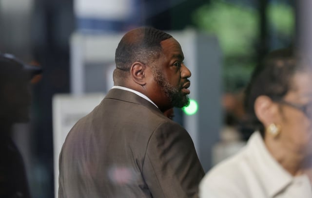 State Sen. Emil Jones III waits in the lobby after attending his bribery trial at the Dirksen U.S. Courthouse, April 16, 2025, in Chicago. (John J. Kim/Chicago Tribune)