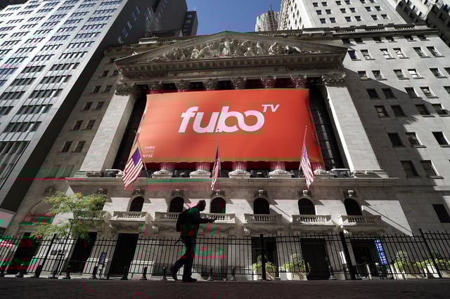 The fuboTV logo is hung from the New York Stock Exchange on the day of its IPO in the Manhattan borough of New York City, New York, U.S., October 8, 2020. REUTERS/Carlo Allegri