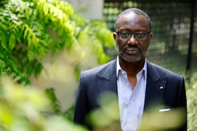 Tidjane Thiam, president of the PDCI (Democratic Party of Cote d'Ivoire), Ivory Coast's main opposition leader and former Credit Suisse Chief Executive, poses after an interview with Reuters in Paris, France, April 23, 2025. REUTERS/Stephanie Lecocq