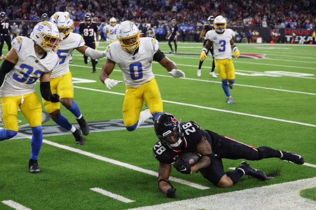 Jan 11, 2025; Houston, Texas, USA;  Houston Texans running back Joe Mixon (28) runs a play against Los Angeles Chargers in the fourth quarter in an AFC wild card game at NRG Stadium. Mandatory Credit: Thomas Shea-Imagn Images/ File Photo