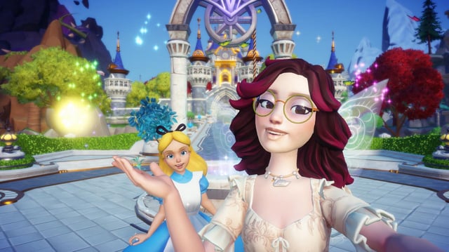 Alice and player in front of the Dream Castle in Disney Dreamlight Valley