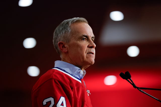 Canada's Prime Minister Mark Carney attends a rally during his Liberal Party election campaign tour in Laval, Quebec, Canada April 22, 2025. REUTERS/Carlos Osorio