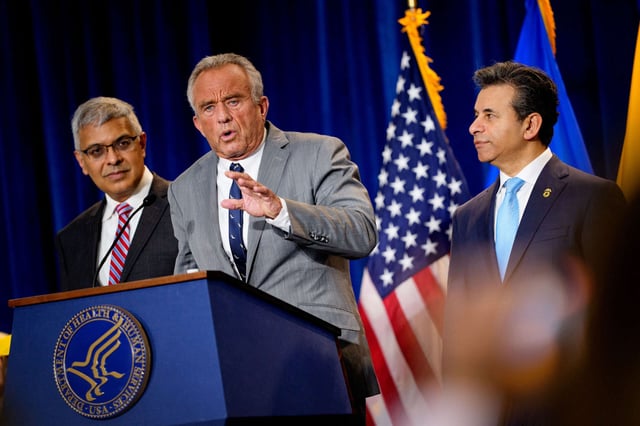 Health and Human Services Secretary Robert F. Kennedy Jr., accompanied by National Institutes of Health Director Jayanta Bhattacharya (left), and Food and Drug Administration Commissioner Marty Makary (right) speaks during a news conference at the Health and Human Services Department on April 22, 2025, in Washington, D.C.