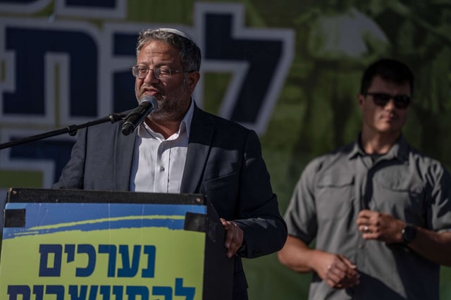 Israeli National Security Minister and far-right politician Itamar Ben-Gvir delivers a speech during a Sukkoth gathering near the Gaza Strip, where far-right activists and members of the Israeli Knesset are holding an event titled 'Preparing to Resettle Gaza,' on October 21, 2024.