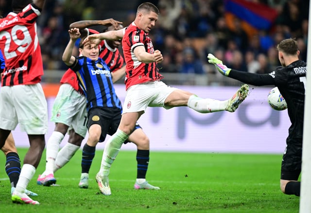 Soccer Football - Coppa Italia - Semi Final - Second Leg - Inter Milan v AC Milan - San Siro, Milan, Italy - April 23, 2025 AC Milan's Luka Jovic scores their second goal REUTERS/Daniele Mascolo