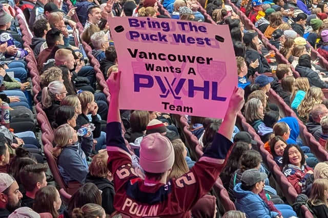 A fan holds up a sign at the sold-out PWHL Takeover Tour game at Rogers Arena in Vancouver on Jan. 8, 2025. 