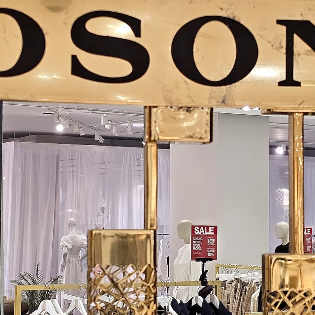 Sale signage is seen at the Hudson's Bay store in Toronto, Tuesday, April 22, 2025. THE CANADIAN PRESS/Giordano Ciampini