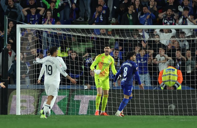 Soccer Football - LaLiga - Getafe v Real Madrid - Estadio Coliseum, Getafe, Spain - April 23, 2025 Real Madrid's Thibaut Courtois celebrates after making a save REUTERS/Isabel Infantes