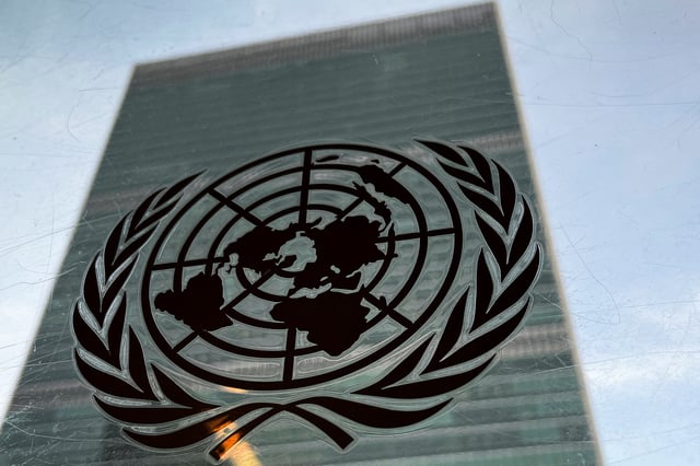 The United Nations headquarters building is pictured with a UN logo in the Manhattan borough of New York City, New York, U.S., March 1, 2022.  REUTERS/Carlo Allegri