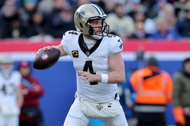 Dec 8, 2024; East Rutherford, New Jersey, USA; New Orleans Saints quarterback Derek Carr (4) drops back to pass against the New York Giants during the first quarter at MetLife Stadium. Mandatory Credit: Brad Penner-Imagn Images/File Photo
