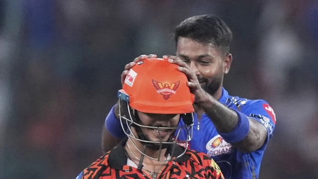 Hardik Pandya, right, gestures as Ishan Kishan walks off the field after losing his wicket during the IPL match between Sunrisers Hyderabad and Mumbai Indians