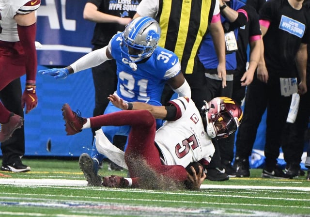 Detroit Lions safety Kerby Joseph tackles Washington Commanders quarterback Jayden Daniels in the first quarter at Ford Field on Jan. 18, 2025, in Detroit. (Daniel Mears/The Detroit News/TNS)