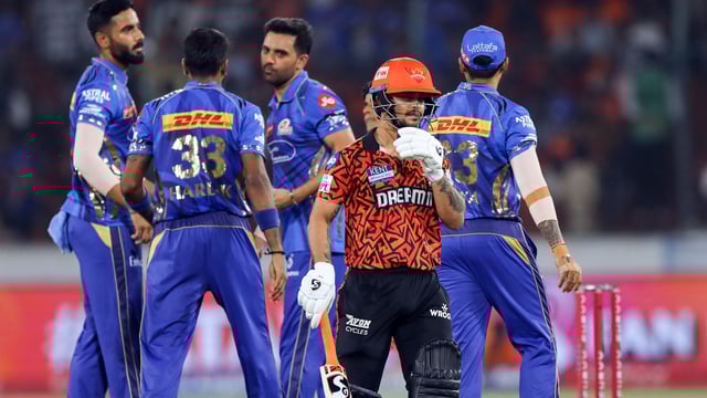 Mumbai Indians' Deepak Chahar and teammate celebrate the wicket of Sunrisers Hyderabad's Ishan Kishan during their IPL 2025 match
