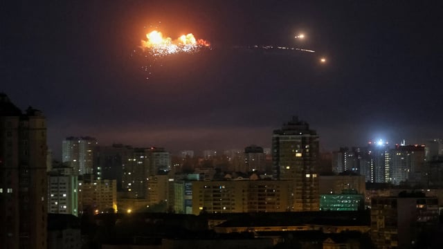 A ballistic missile explodes in the sky over the city during a Russian drone strike in Kyiv, Ukraine, April 24, 2025.