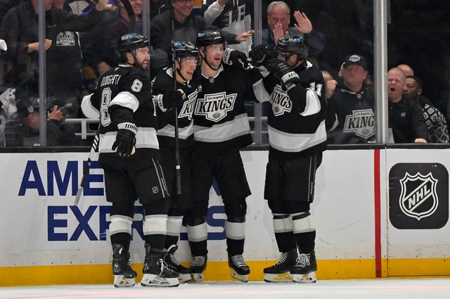 Apr 23, 2025; Los Angeles, California, USA; Los Angeles Kings celebrate after a goal by right wing Adrian Kempe (9) in the third period of game 2 of the 2025 Stanley Cup Playoffs against the Edmonton Oilers at Crypto.com Arena. Mandatory Credit: Jayne Kamin-Oncea-Imagn Images