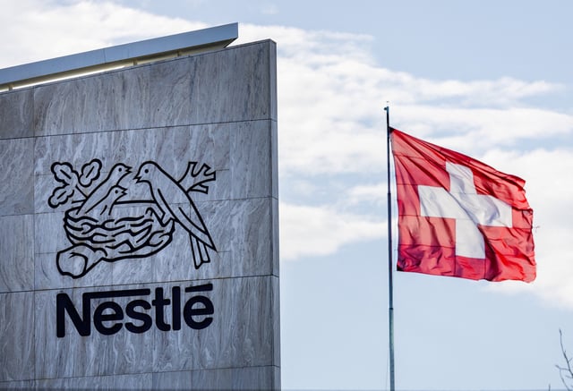 A Swiss flag flutters on the headquarters of Nestle in Vevey, Switzerland, November 25, 2024. REUTERS/Denis Balibouse/File Photo