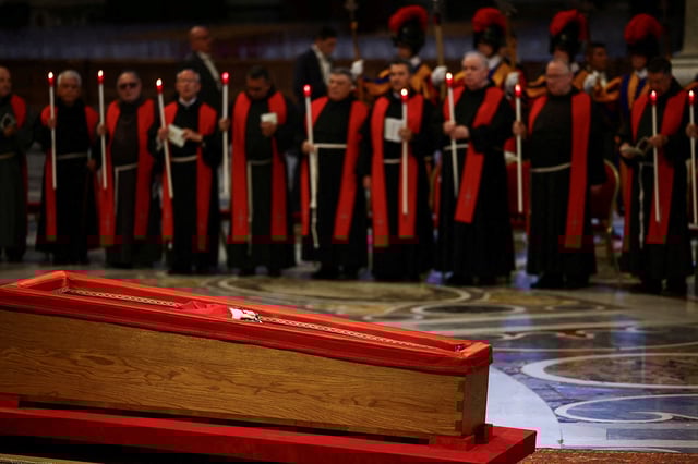 Pope Francis' body rests inside his coffin, on the day of the translation of his body, in St. Peter's Basilica at the Vatican, April 23, 2025. REUTERS/Yara Nardi