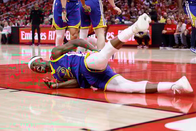 Jimmy Butler III of the Golden State Warriors goes to the floor after being fouled by Amen Thompson of the Houston Rockets in the first half in Game Two of the Western Conference First Round NBA Playoffs in Houston, Texas, at Toyota Center on April 23, 2025.