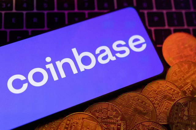 Smartphone with displayed Coinbase logo and representation of cryptocurrencies are placed on a keyboard in this illustration taken, June 8, 2023. REUTERS/Dado Ruvic/Illustration/File Photo